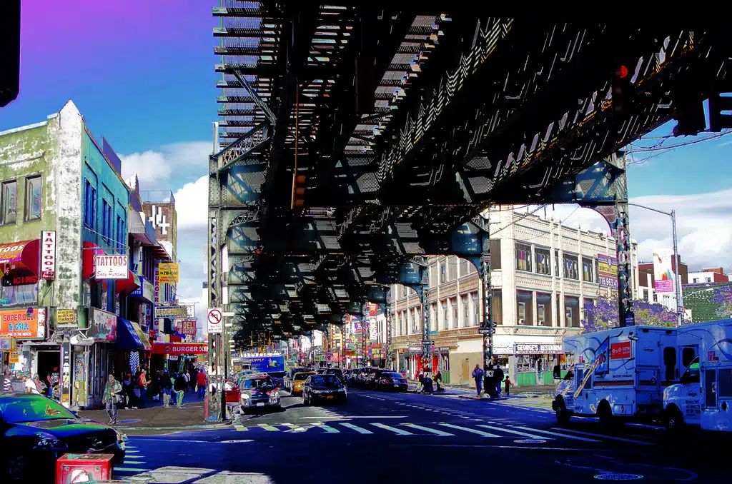 Urban scene in Bushwick with colorful street art and a cannabis dispensary, showcasing Brooklyn's vibrant cannabis culture. Bushwick Cannabis Culture